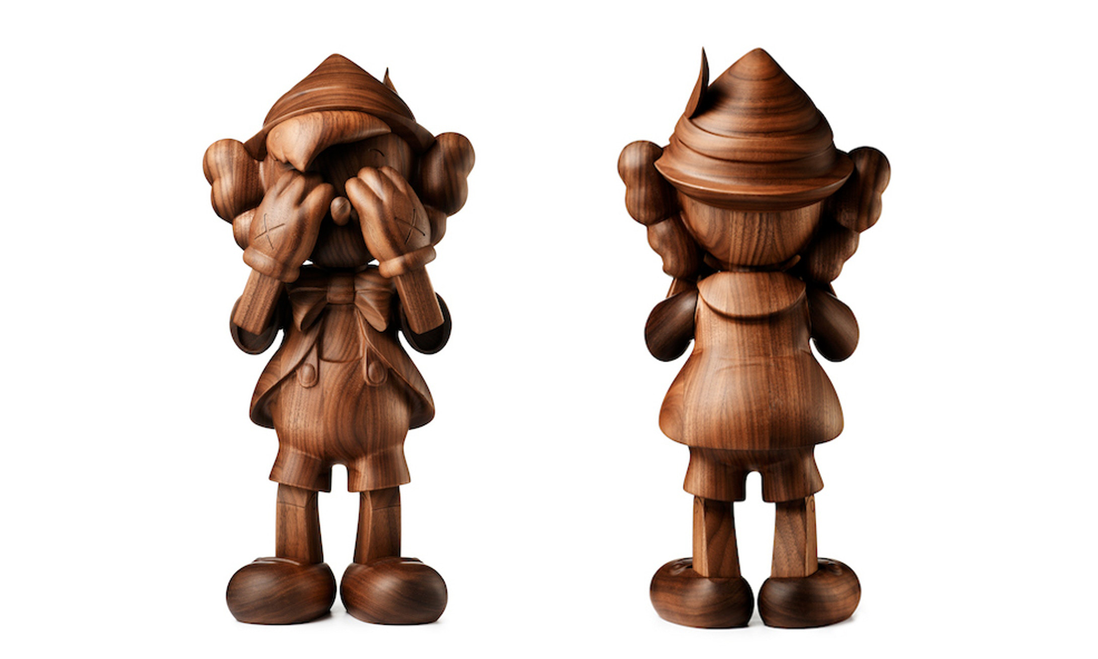 近期的 KAWS 设计中，这款木质匹诺曹雕塑是绝对的至尊作品